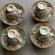 Four coffee cups and matching saucers in porcelain.