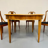 Round walnut Napoleon III extendable table with bronze top in good condition.