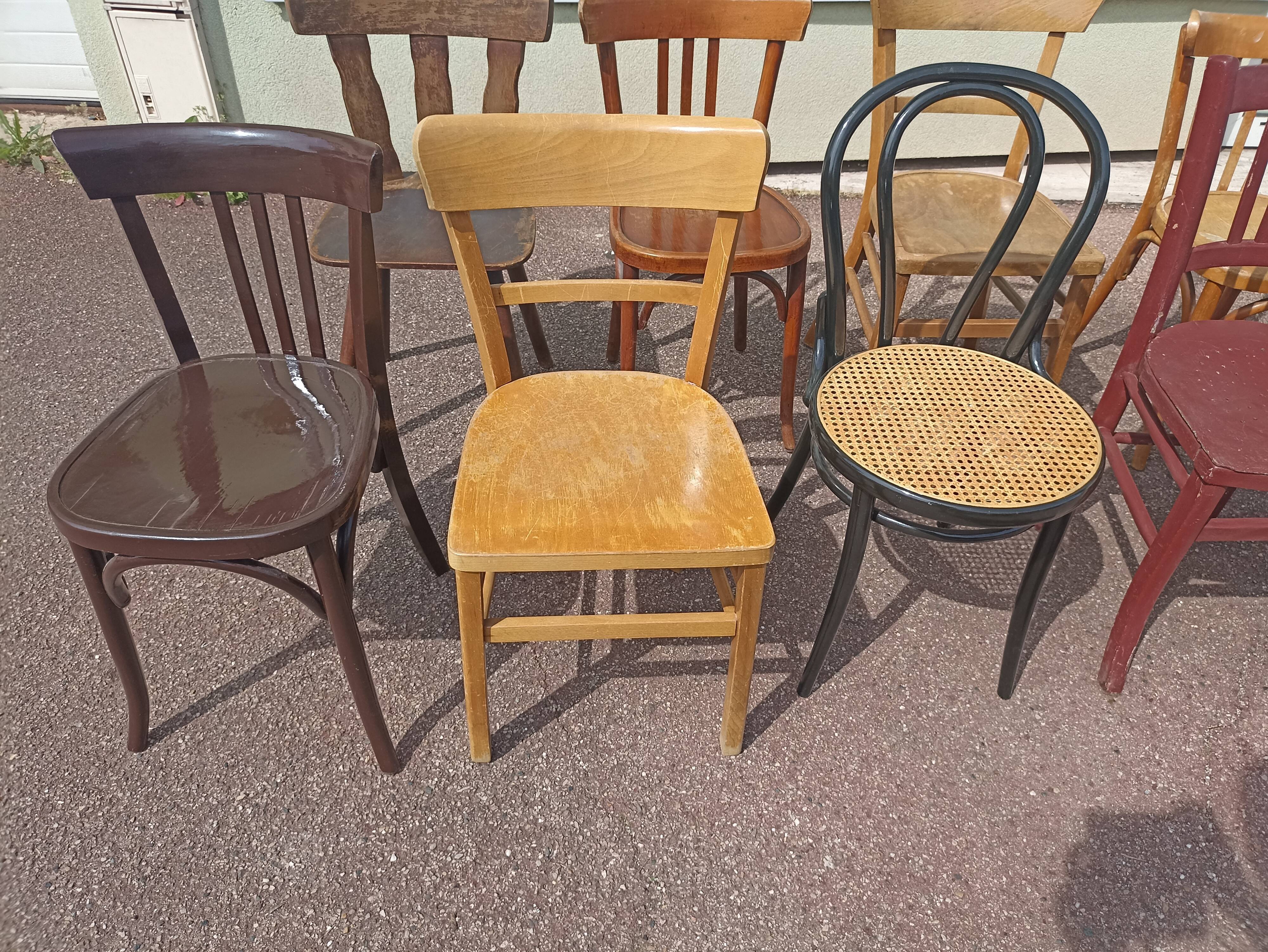 Set of 12 mismatched wooden bistro chairs