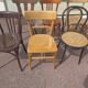 Set of 12 mismatched wooden bistro chairs