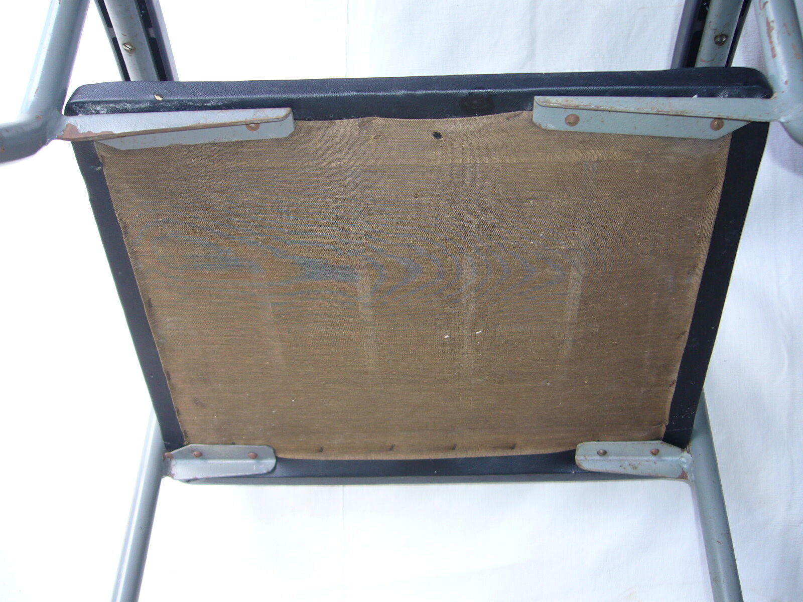 Old industrial chair in skai and metal