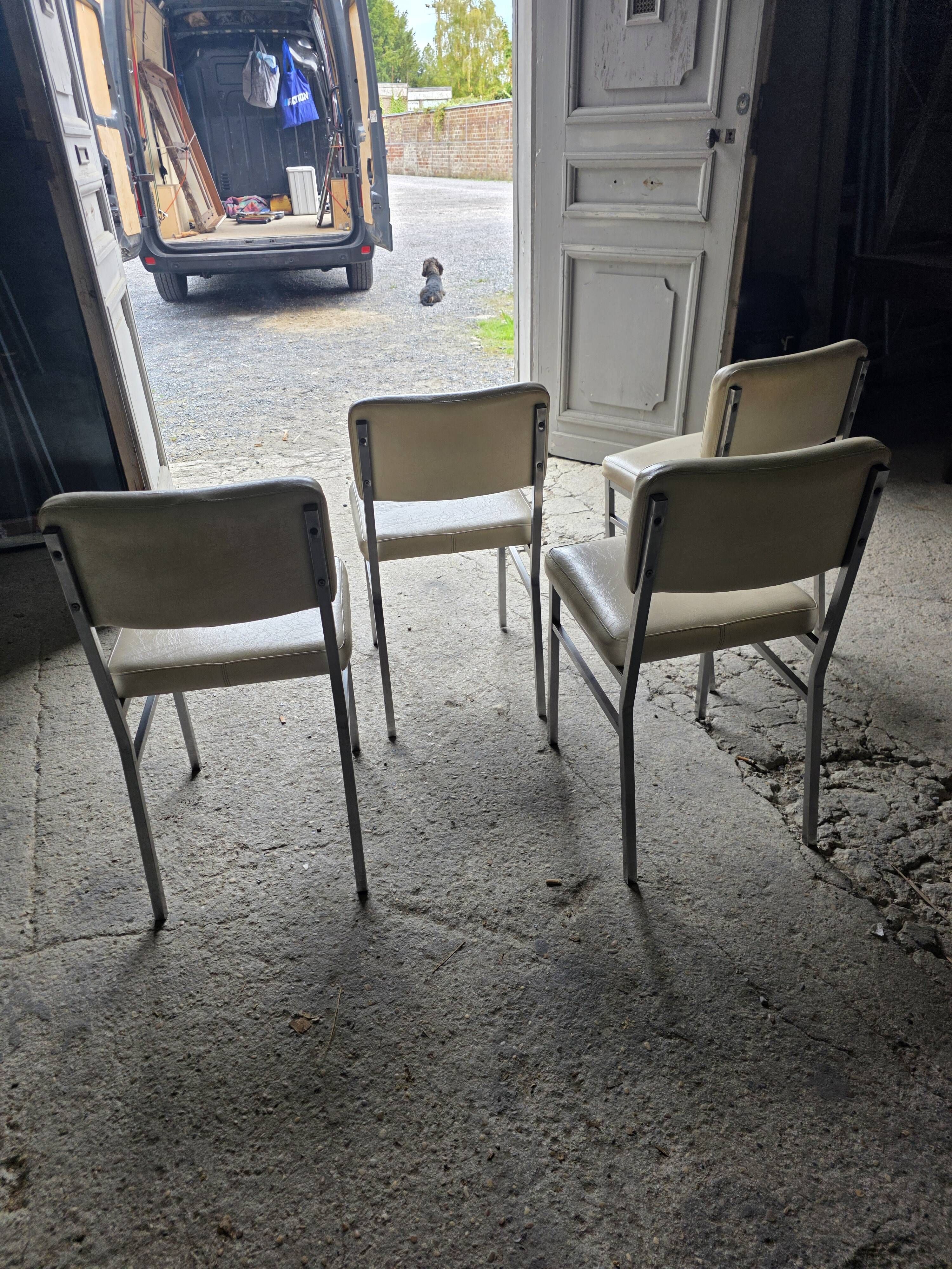 4 chrome metal chairs with faux leather from the 1970s.