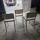 4 chrome metal chairs with faux leather from the 1970s.