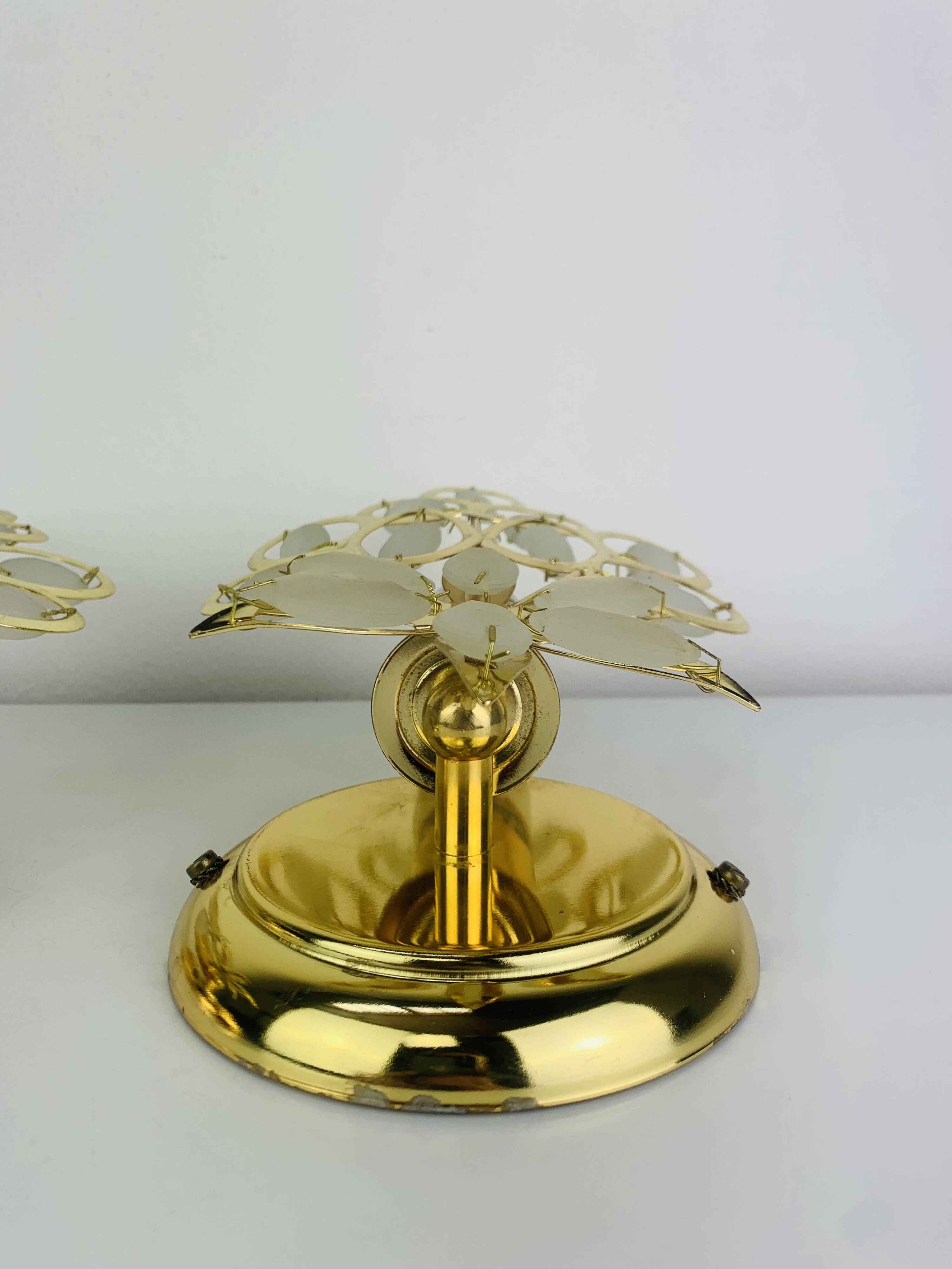 Pair of Hollywood Regency wall lights with glass and gold metal pendants Mathias