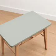 Small vintage children's desk attributed to Baumann – natural wood and lizard green top.