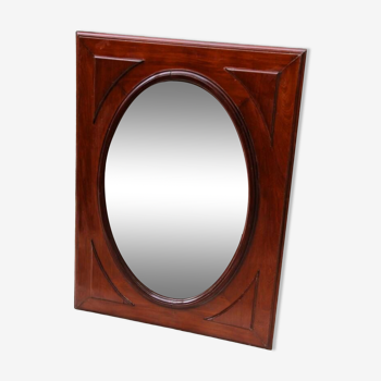 Oval mirror in beveled glass and solid mahogany