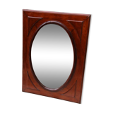Oval mirror in beveled glass and solid mahogany