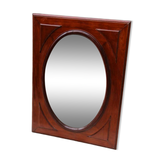 Oval mirror in beveled glass and solid mahogany