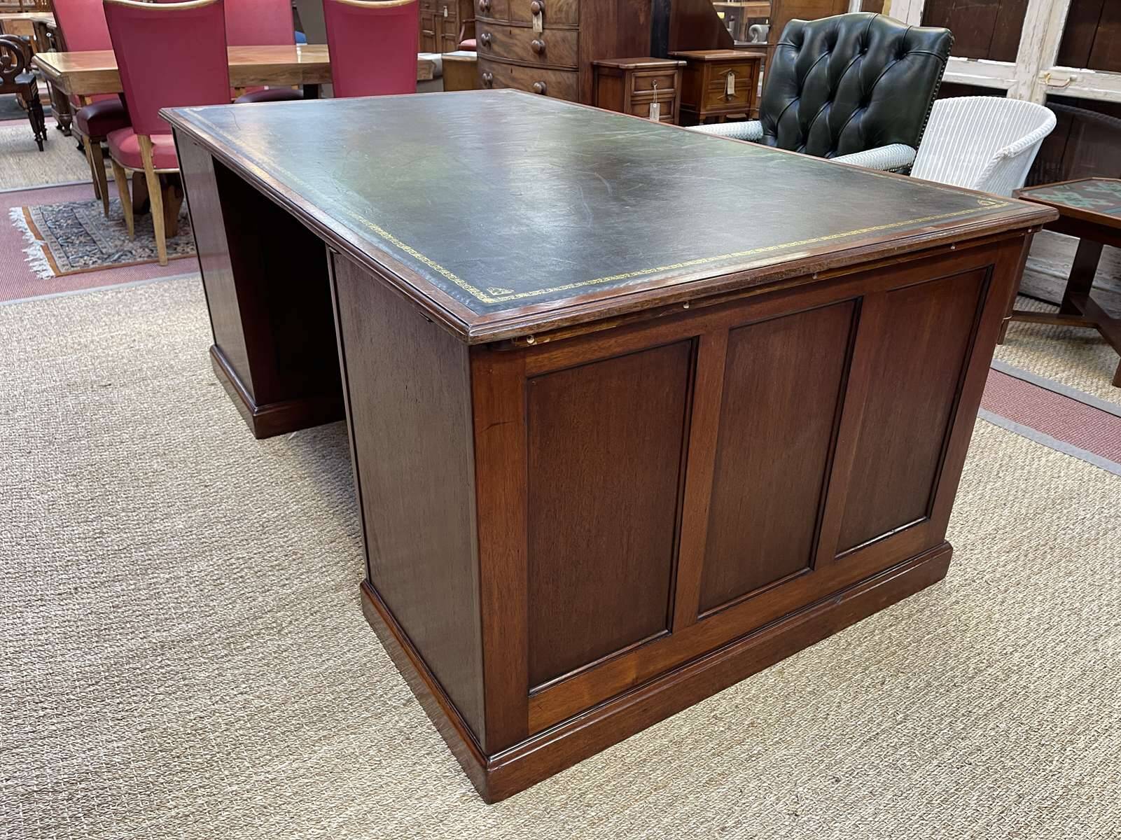 Large English flat desk in mahogany with leather top, early 20th century