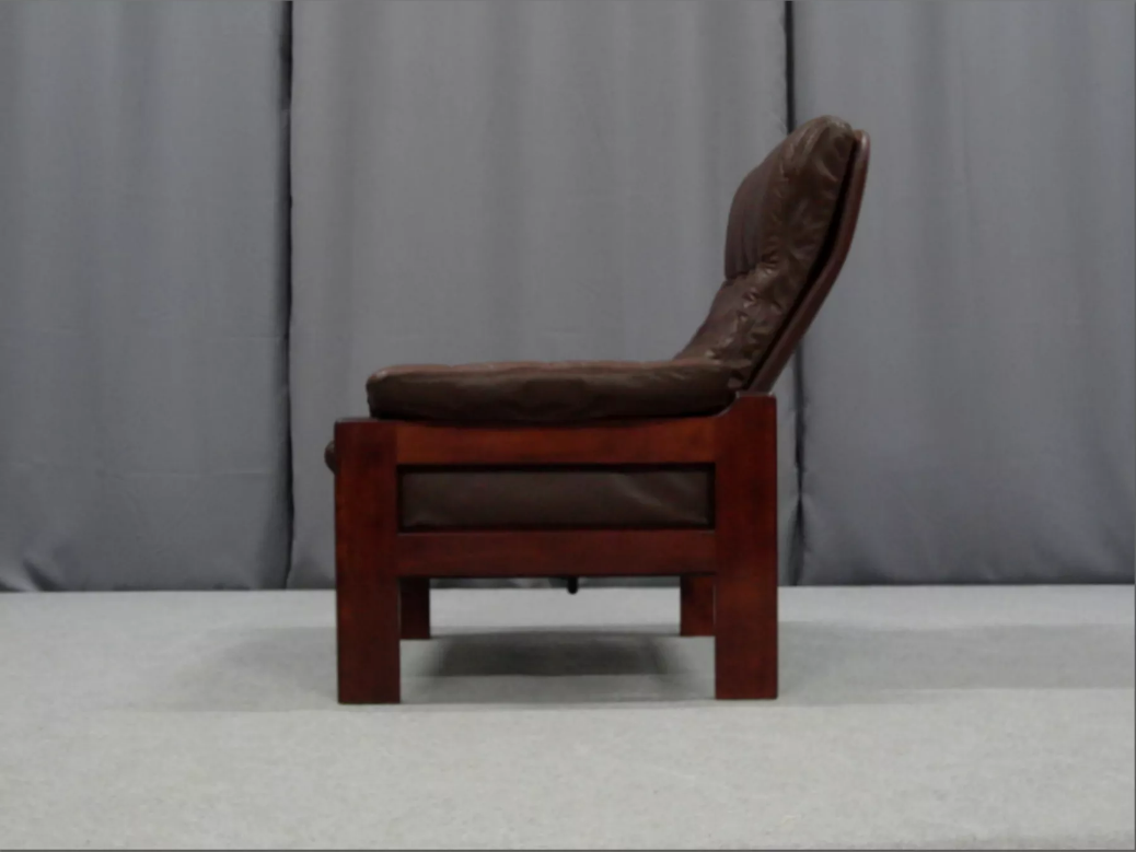 Pair of armchairs and ottoman in leather, 1970