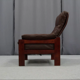 Pair of armchairs and ottoman in leather, 1970