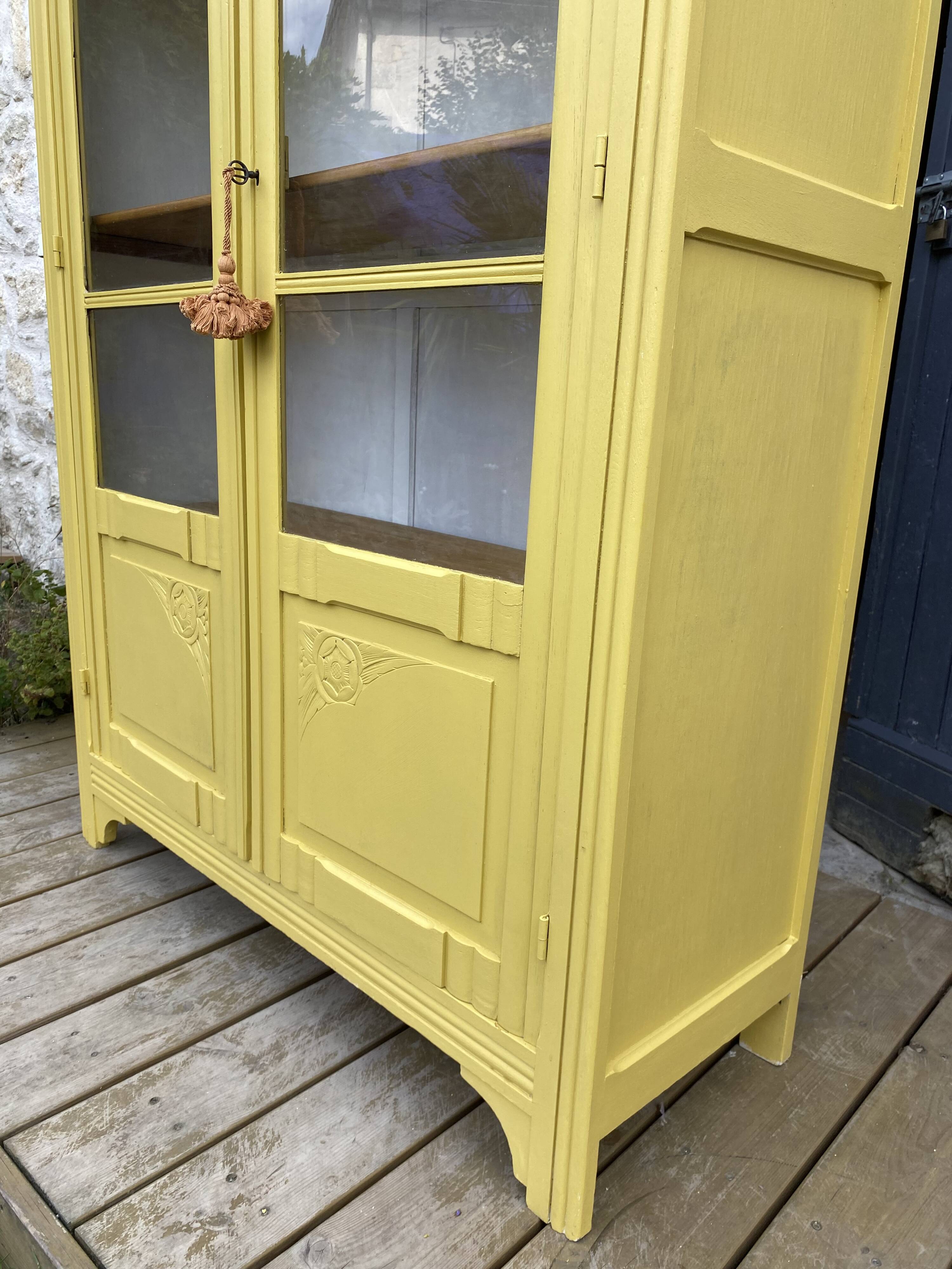 Antique yellow display cabinet