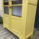 Antique yellow display cabinet