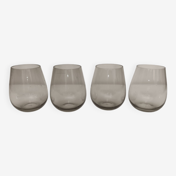 4 Guy Degrenne Dolce lightly smoked glasses in gray glass.