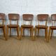 5 chaises années 1960 type scandinave bois et skaï marron fabrication artisanale française Raincy
