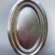 Oval stainless steel dish, signed Rémi Letang