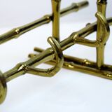 Bamboo-like coat rack in bronze