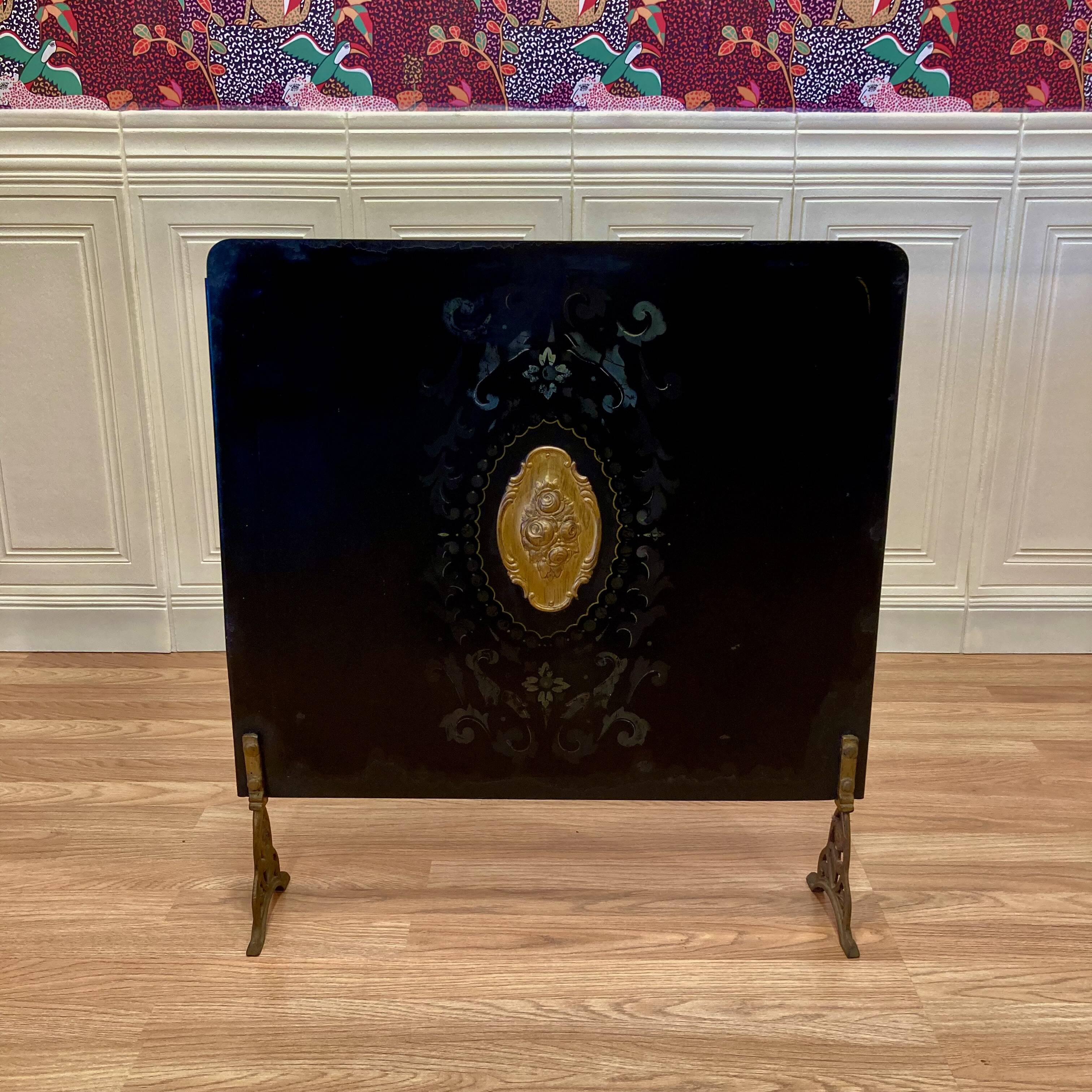 Metal fireplace screen from the period.