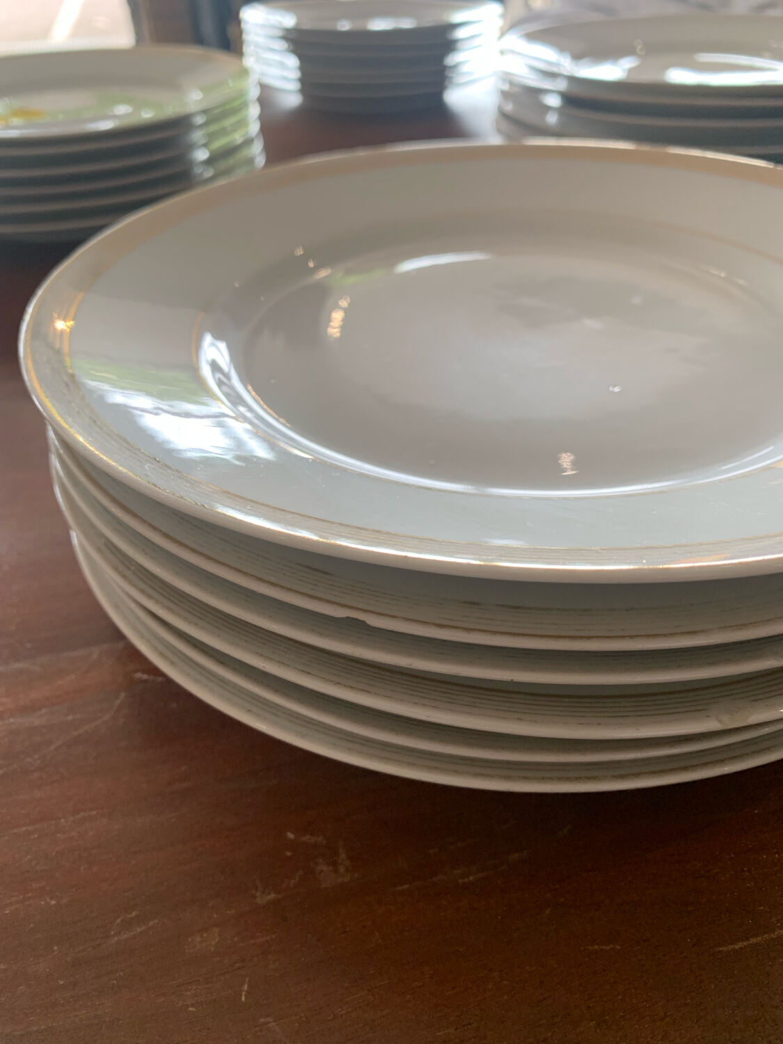 Lot of six flat plates, crockery, old white, gilded
