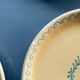 The six Piaf plates in painted terracotta