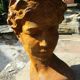 Cast iron sculpture of a woman.