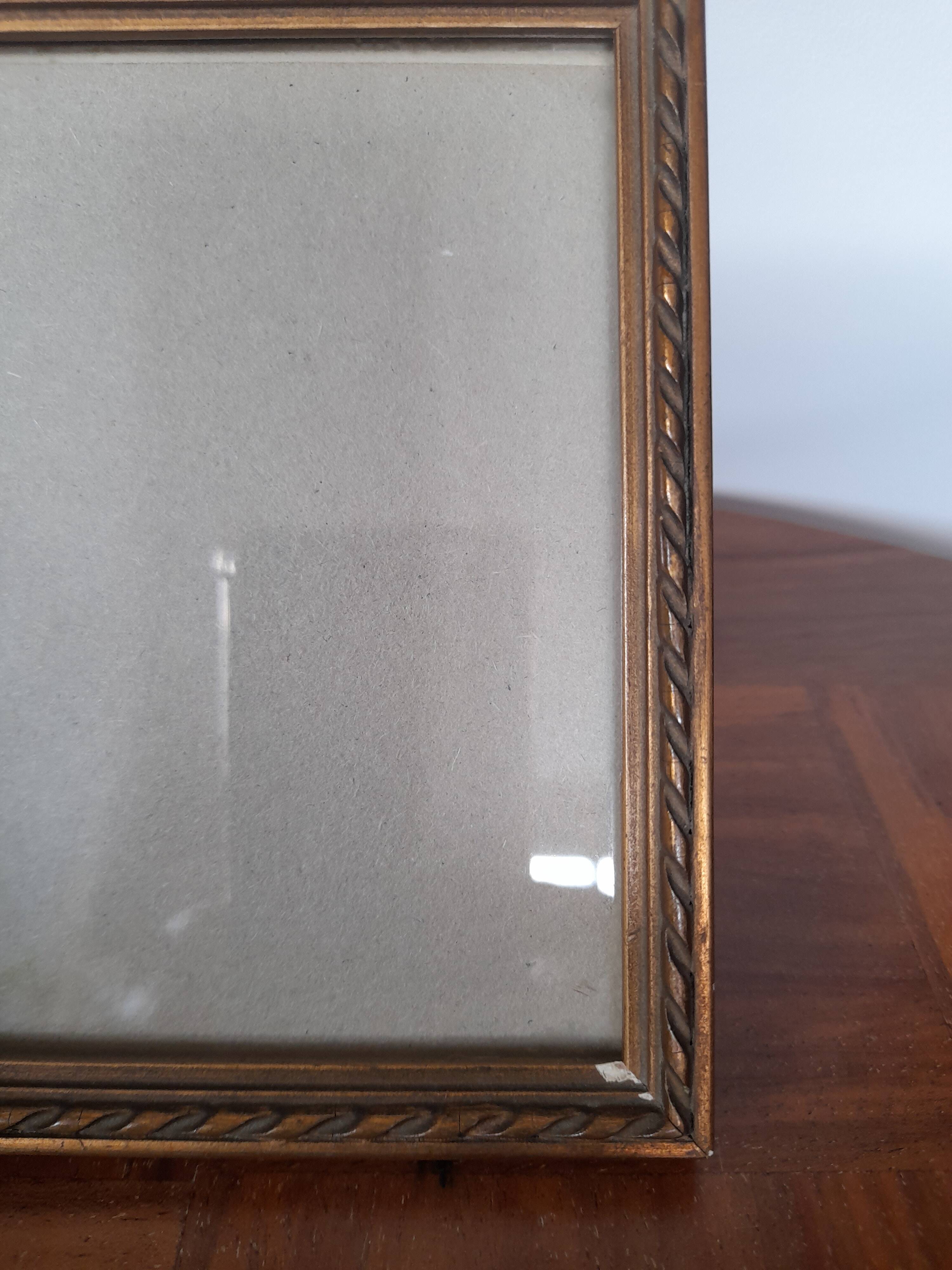 Old square golden frame to place or hang