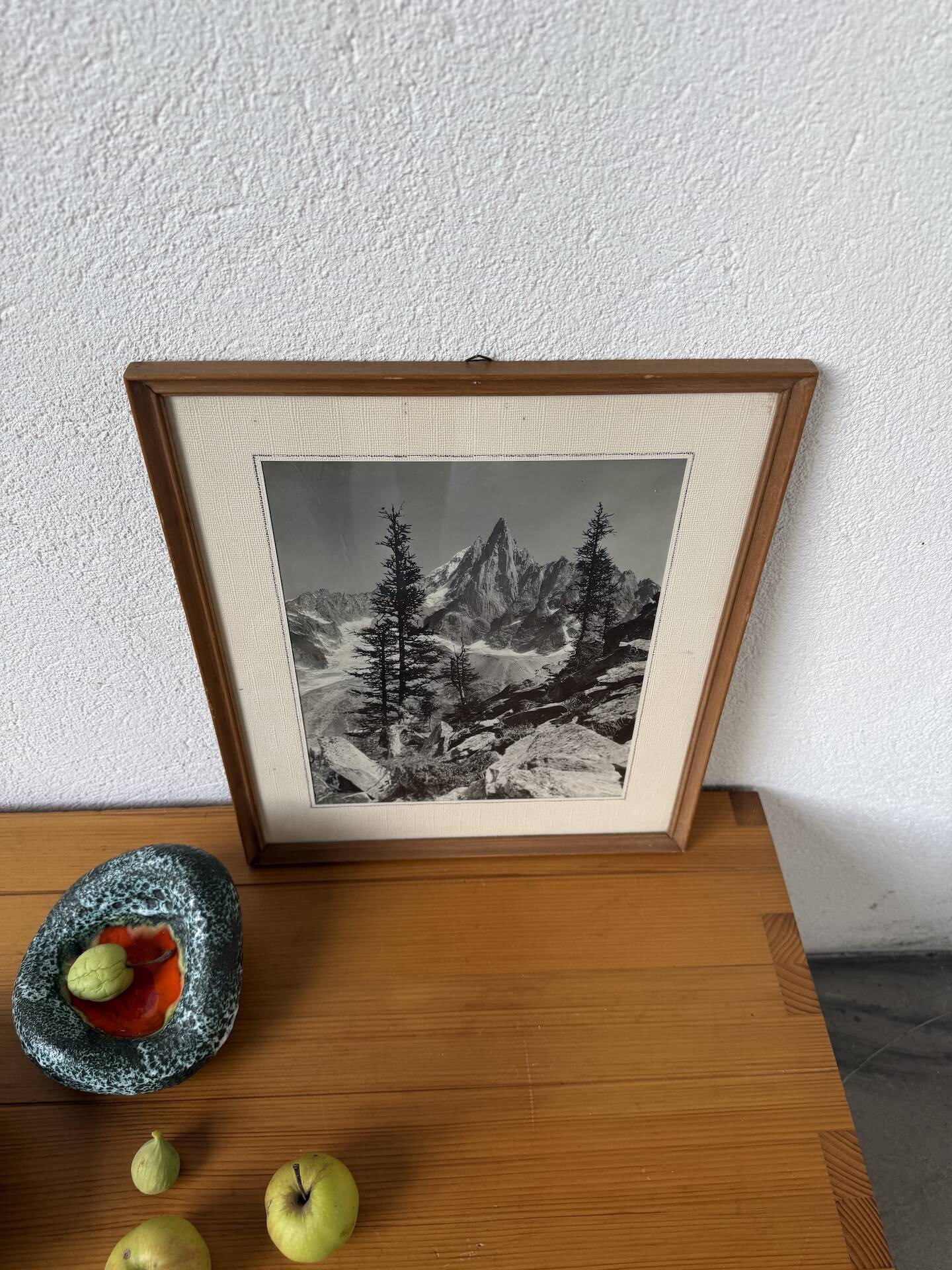 Framed old photo of a mountain landscape.