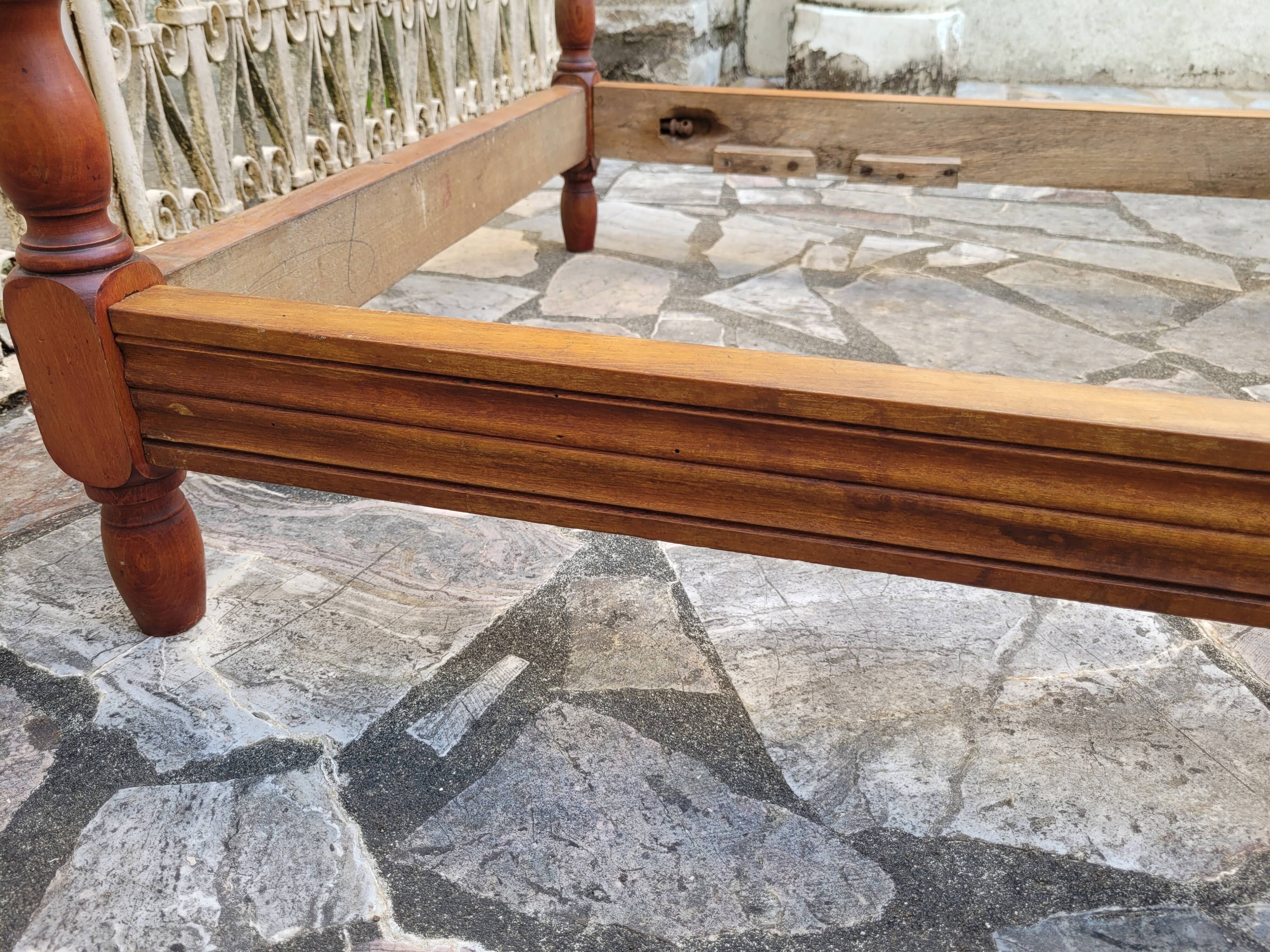 Child's bed or vintage rest bed made of solid cherry wood in a bamboo style.