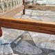 Child's bed or vintage rest bed made of solid cherry wood in a bamboo style.