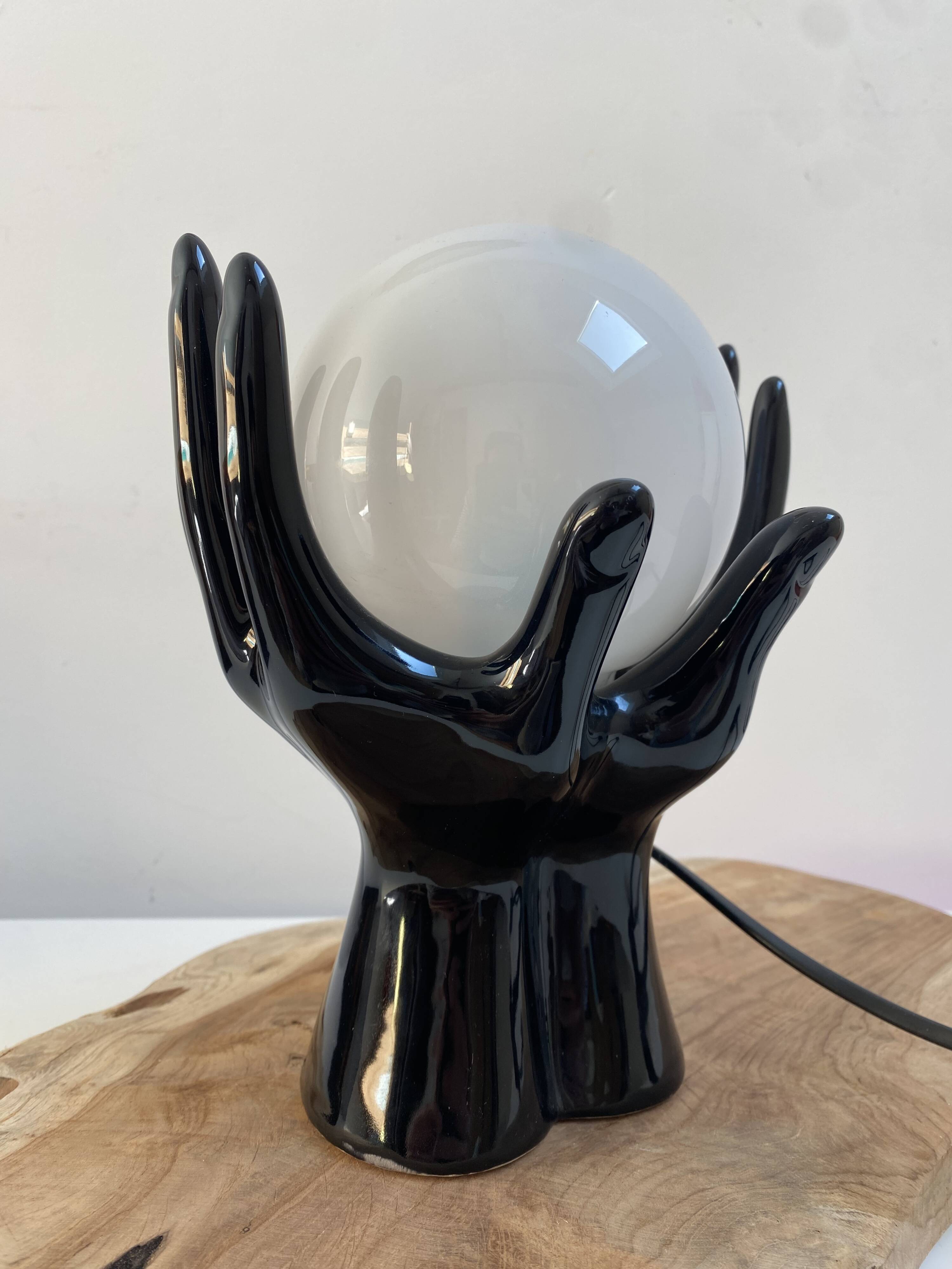 Sculpted ceramic globe lamp.