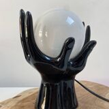 Sculpted ceramic globe lamp.