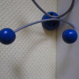 Grey metal wall hook, 4 wooden hangers