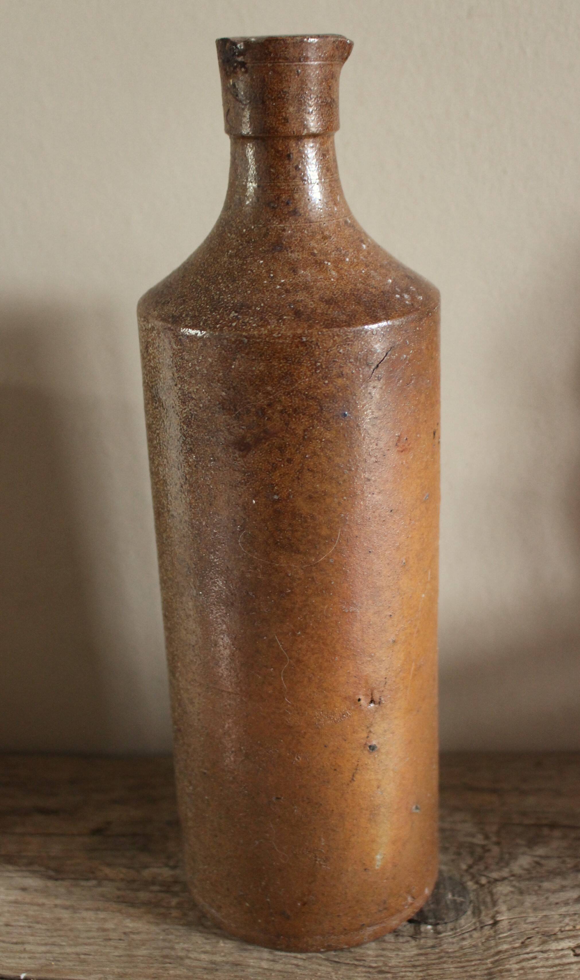 Vintage stoneware liqueur bottle with spout