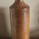 Vintage stoneware liqueur bottle with spout