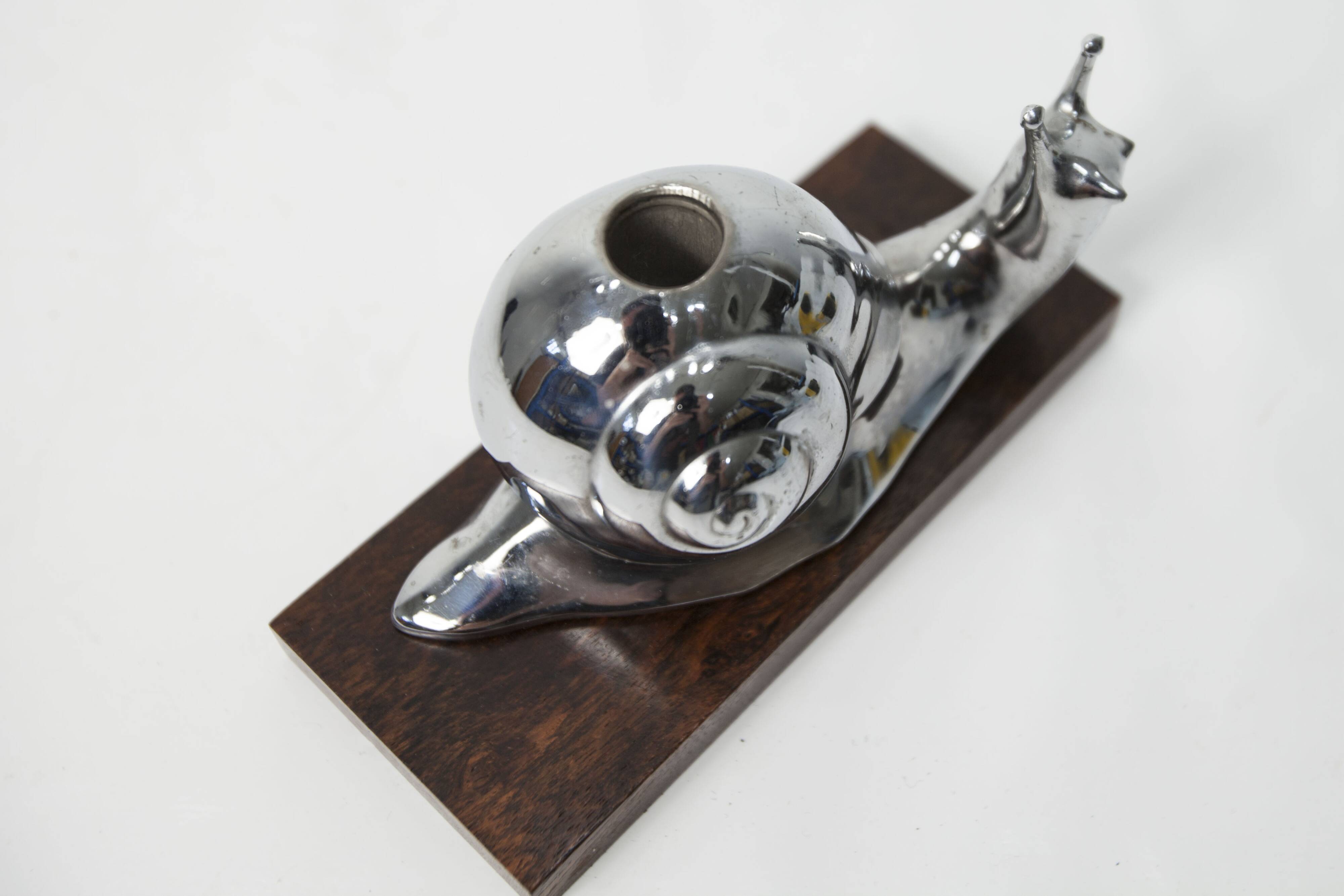 Silver snail candlestick on a teak base 1960