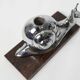 Silver snail candlestick on a teak base 1960