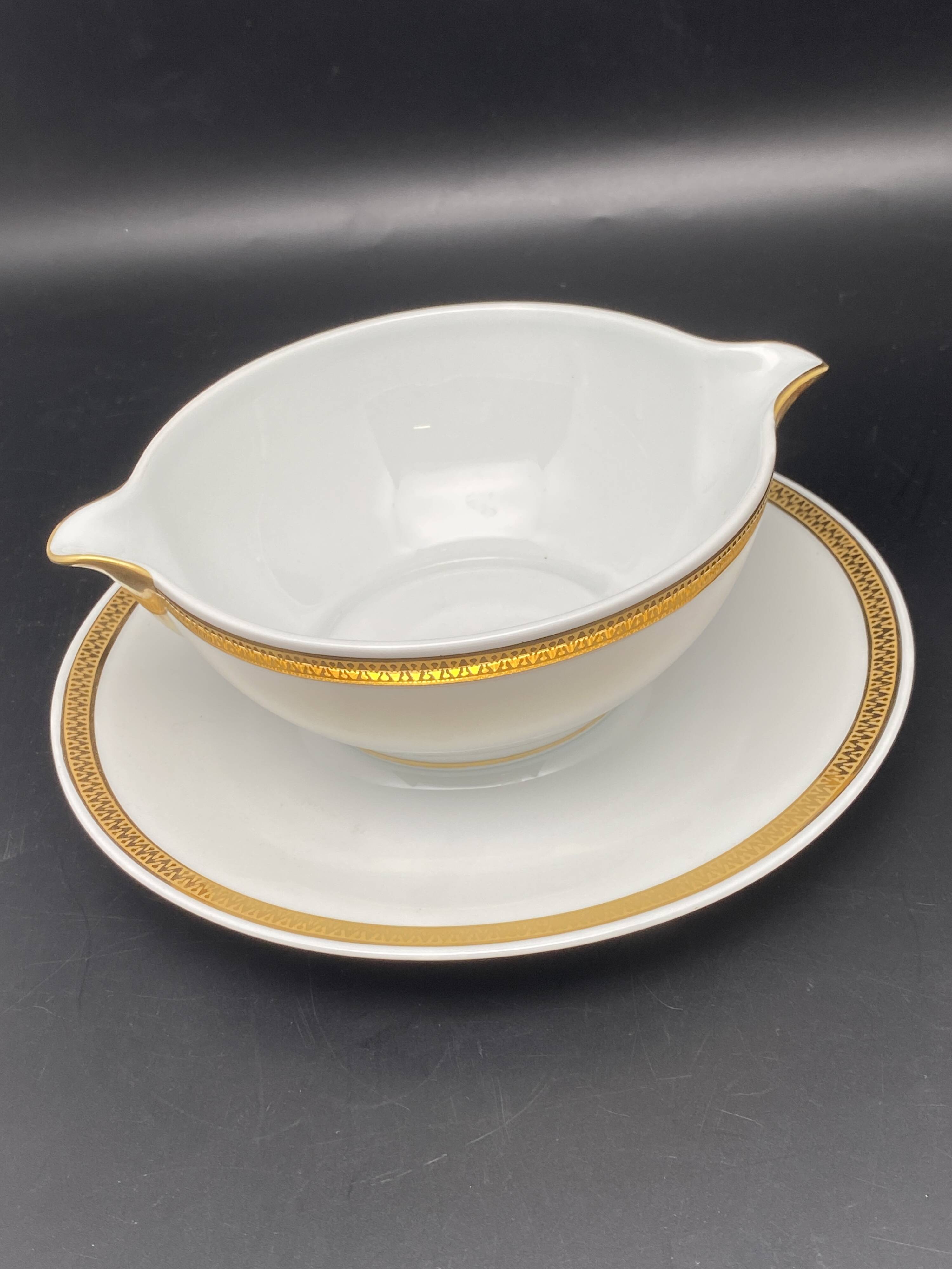 Limoges porcelain gravy boat with gold edging