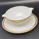 Limoges porcelain gravy boat with gold edging