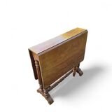 “Gateleg” folding walnut table