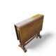 “Gateleg” folding walnut table