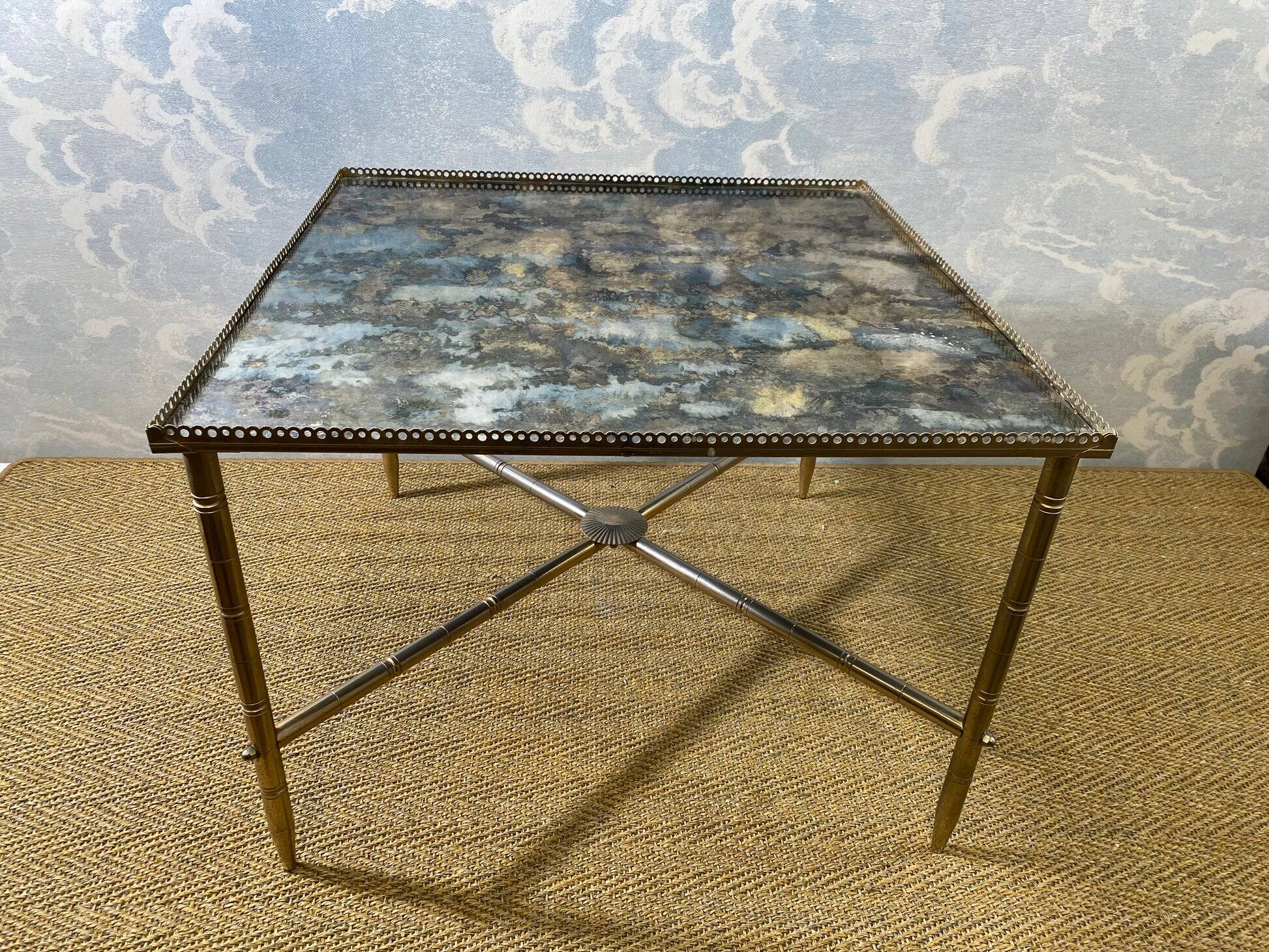 Side table with oxidised metal mirror top on a brass frame, France, 1960s.