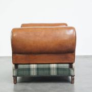 Antique daybed reupholstered with sheepskin and Scottish tartan wool