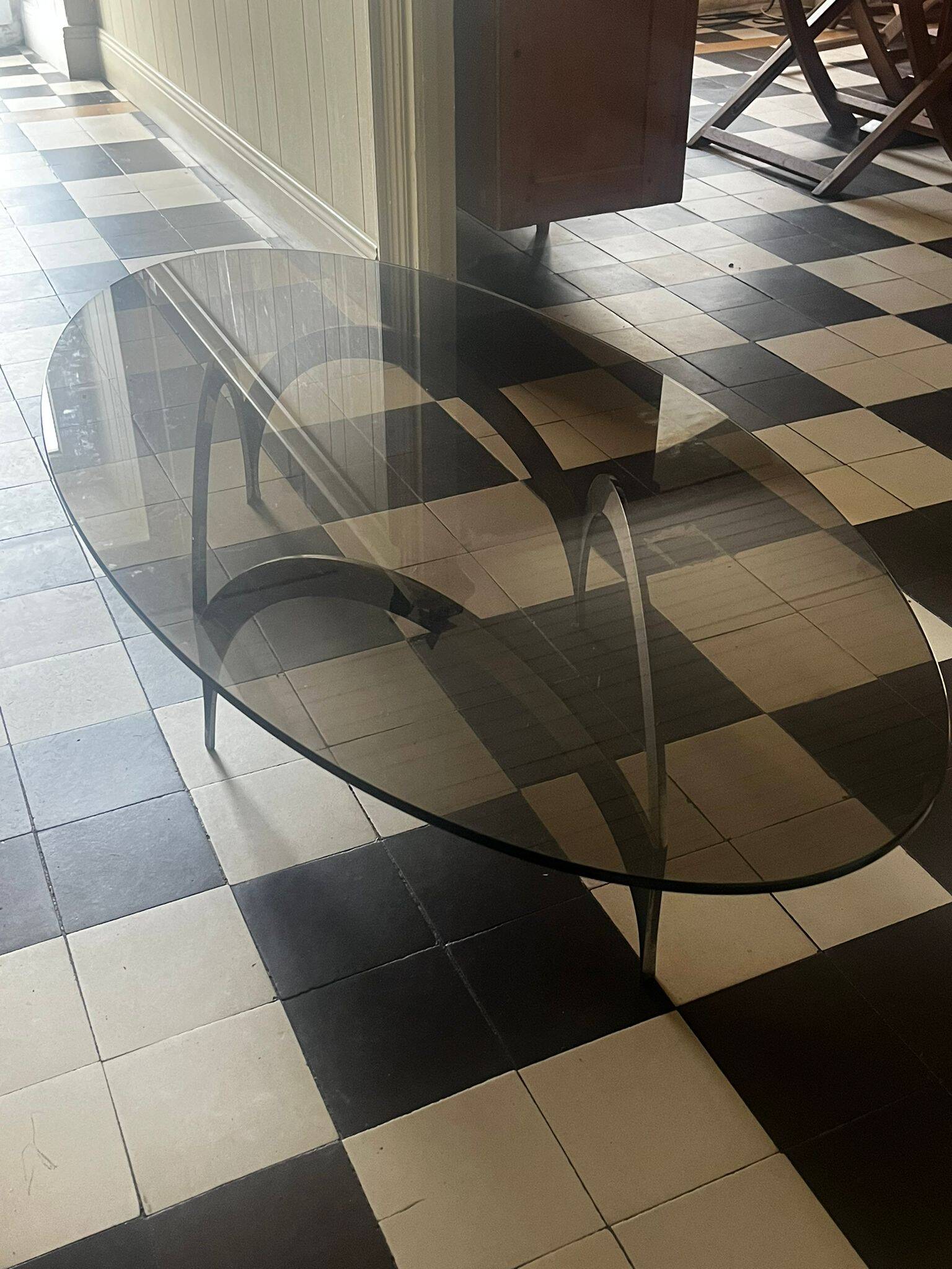 coffee table with metal legs and smoked glass top