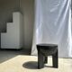 Black mango wood tripod side table with a semi-spherical top, height: 45 cm, diameter: 44 cm.