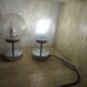 Duo of textured globe lamps with a large play of light.