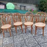 4 tanned bistro chairs