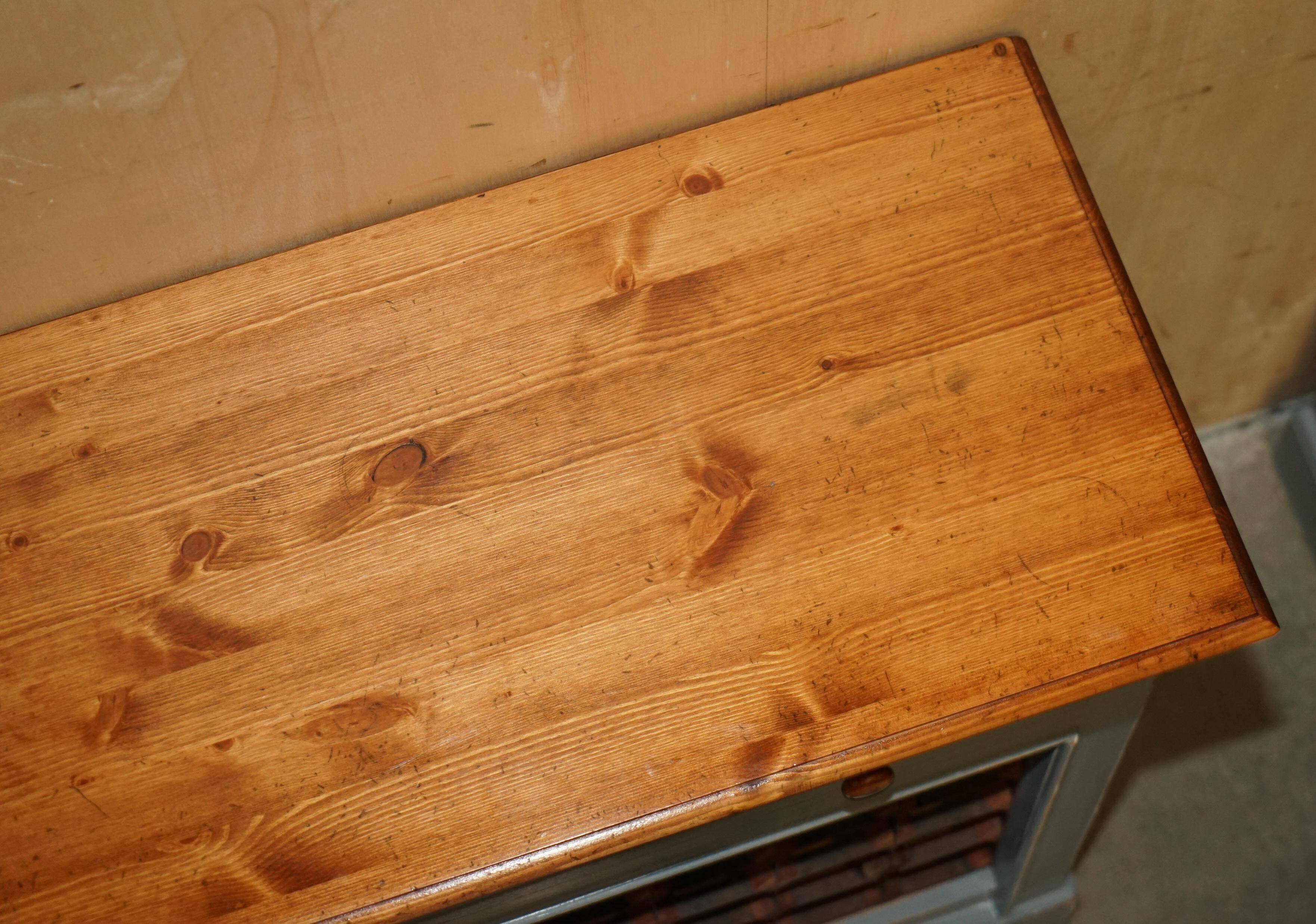 Vintage wooden furniture for 45 wine bottles with a drawer.