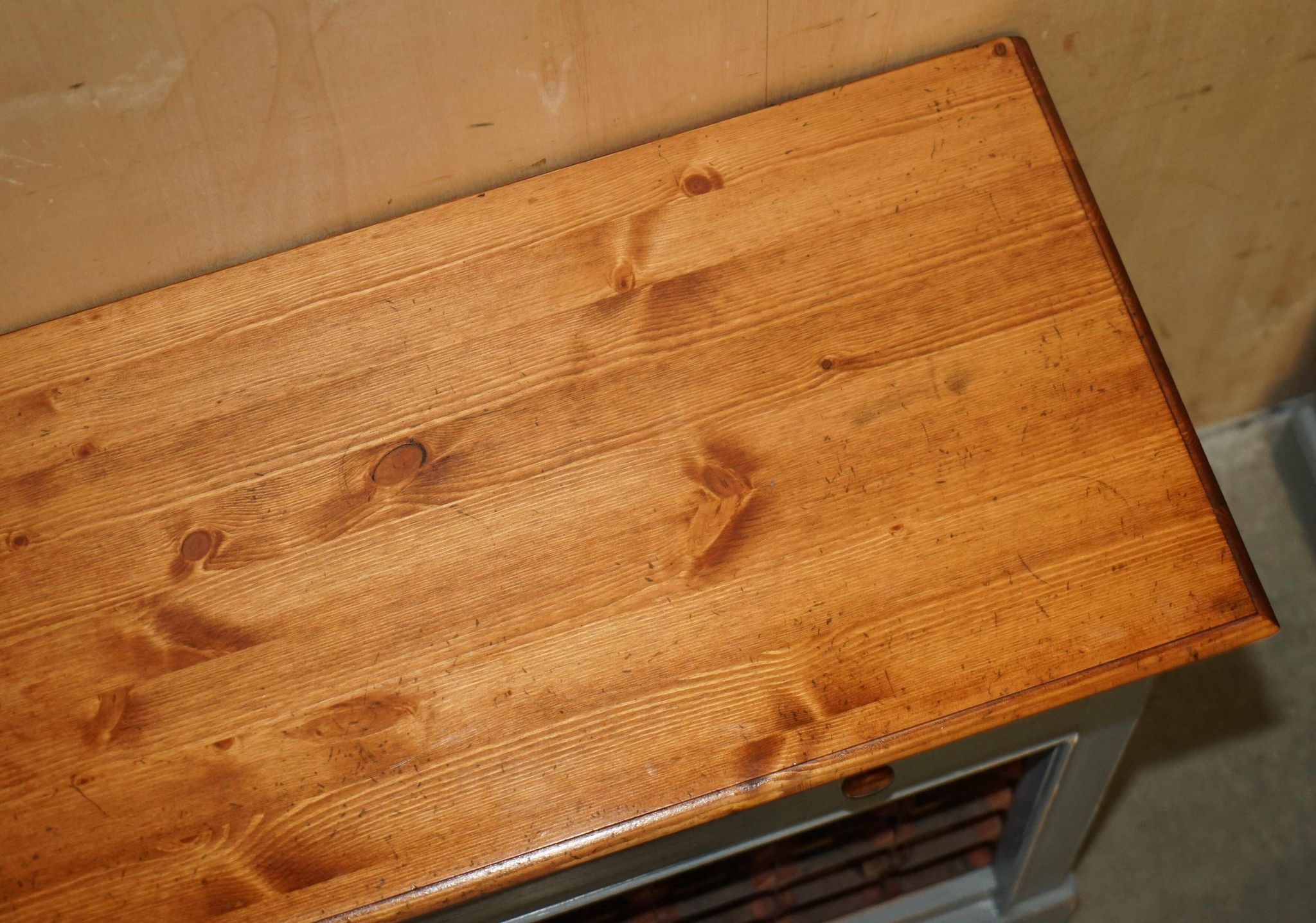 Vintage wooden furniture for 45 wine bottles with a drawer.