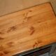Vintage wooden furniture for 45 wine bottles with a drawer.