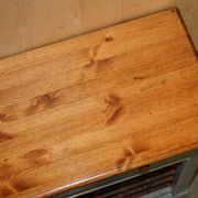 Vintage wooden furniture for 45 wine bottles with a drawer.
